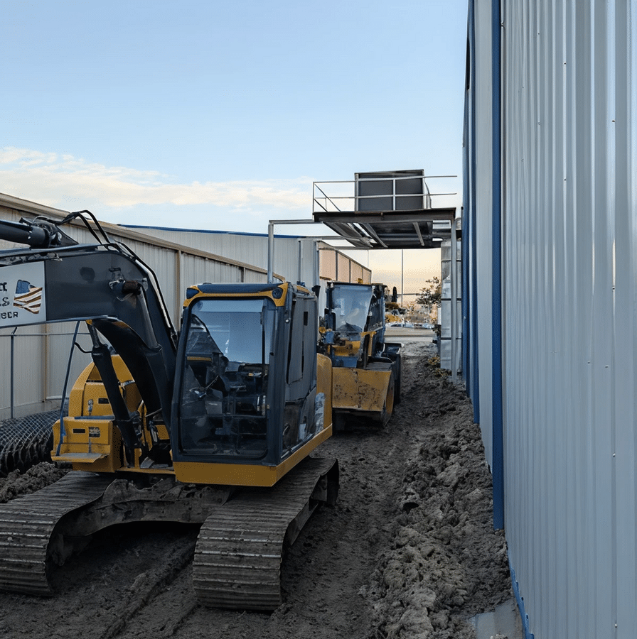 Excavators working alongside a commercial building