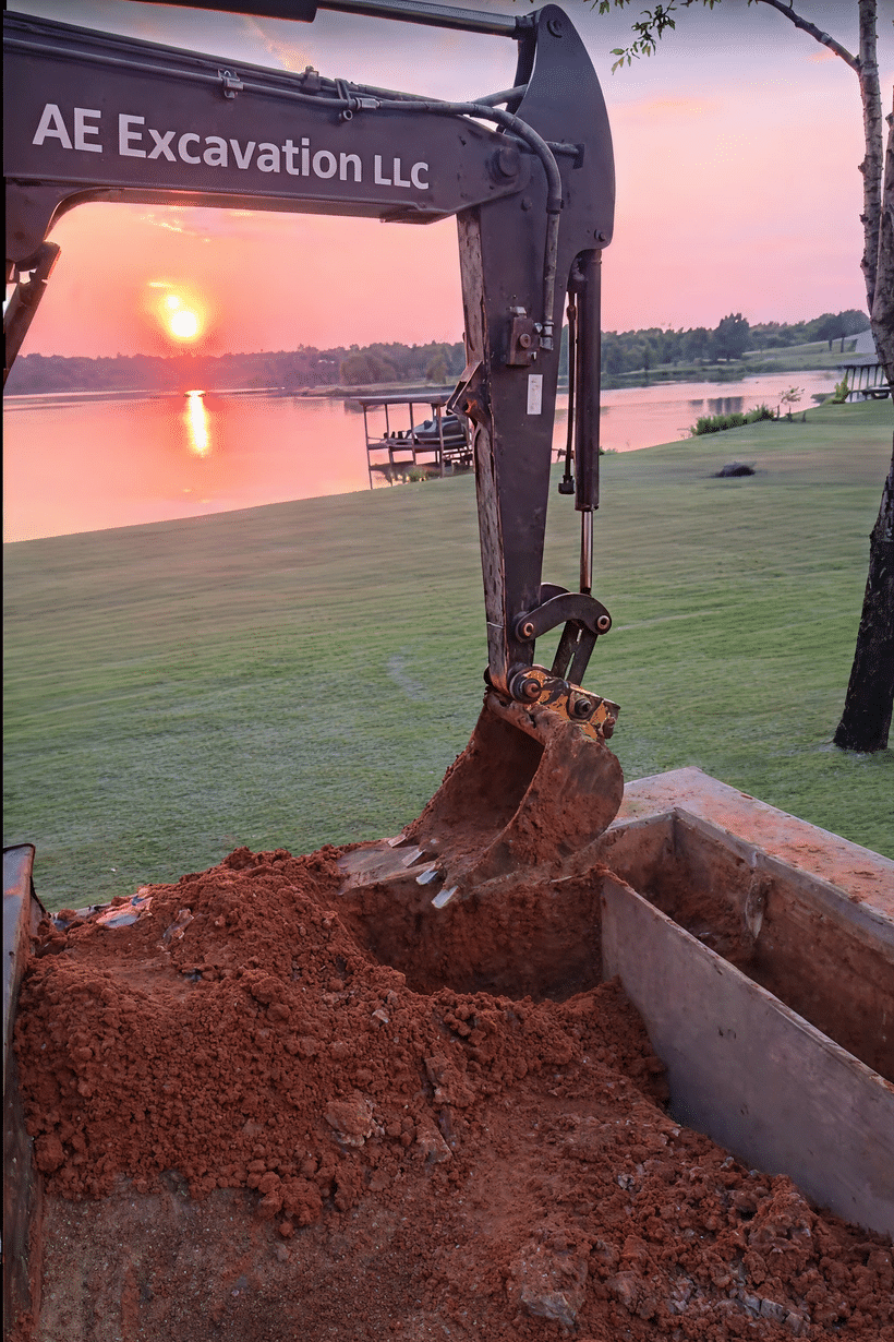 Excavator trenching and moving soil on a Montgomery County job